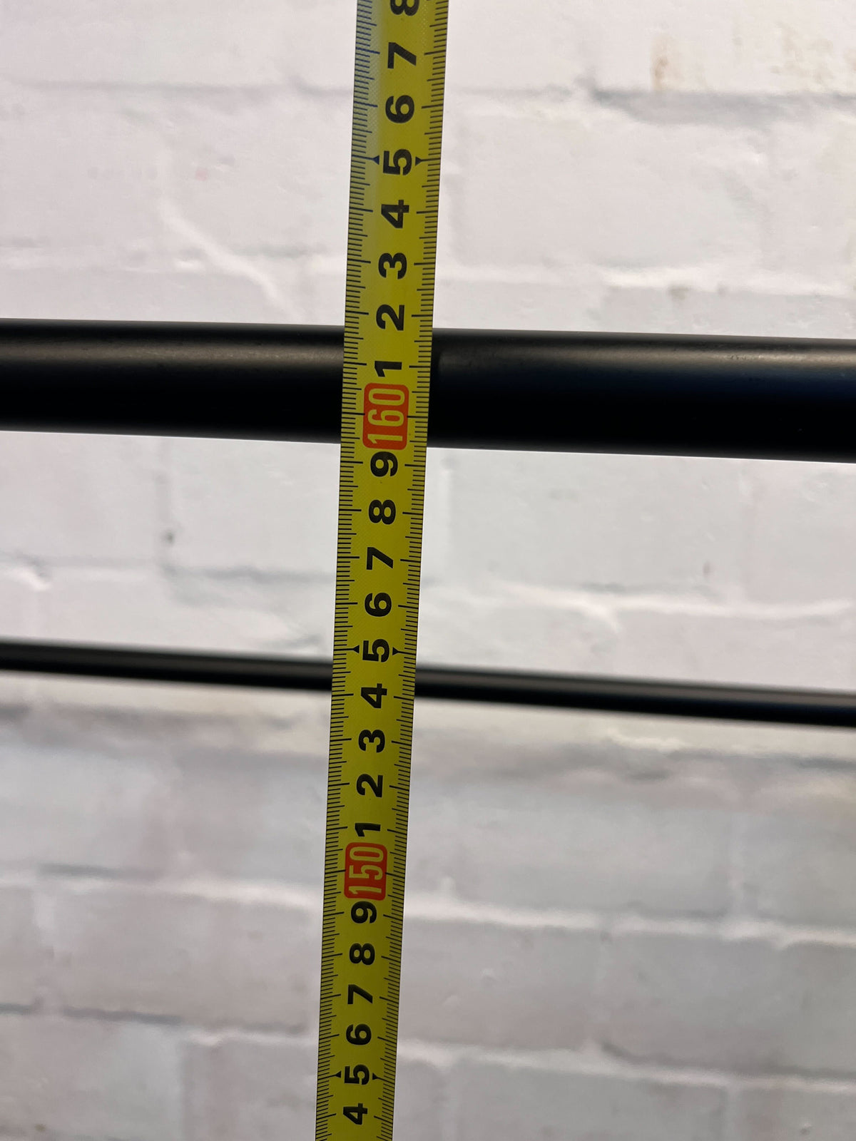 Stylish Black Metal Clothing Rack on Wheels