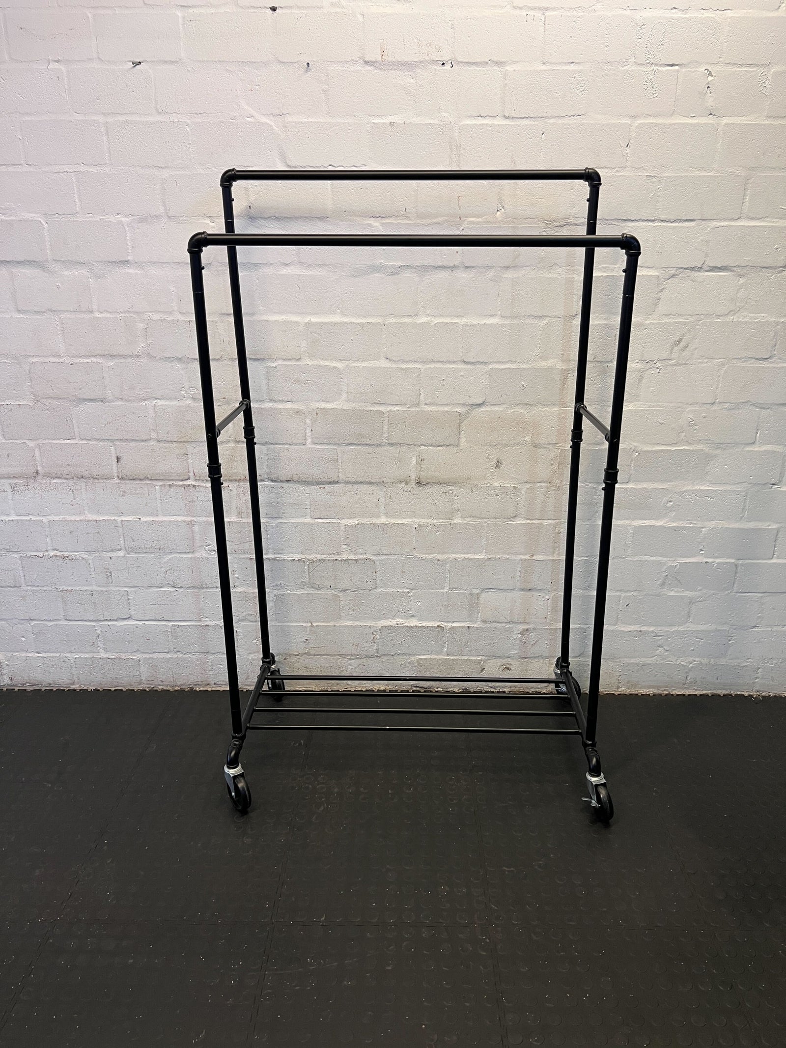 Stylish Black Metal Clothing Rack on Wheels