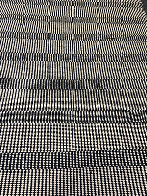 Stylish Black and White Woven Area Rug - Minimalist Design, Slight Wear