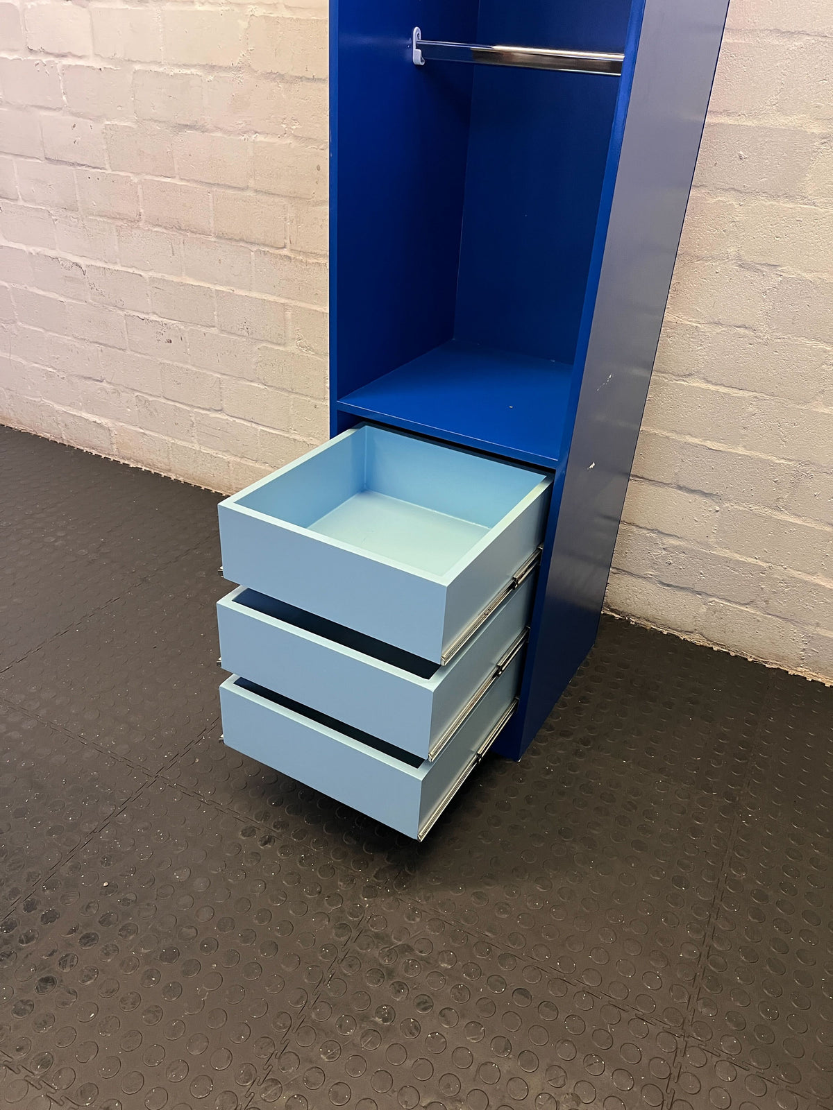 Stylish Blue Storage Unit with Drawers and Hanging Rod