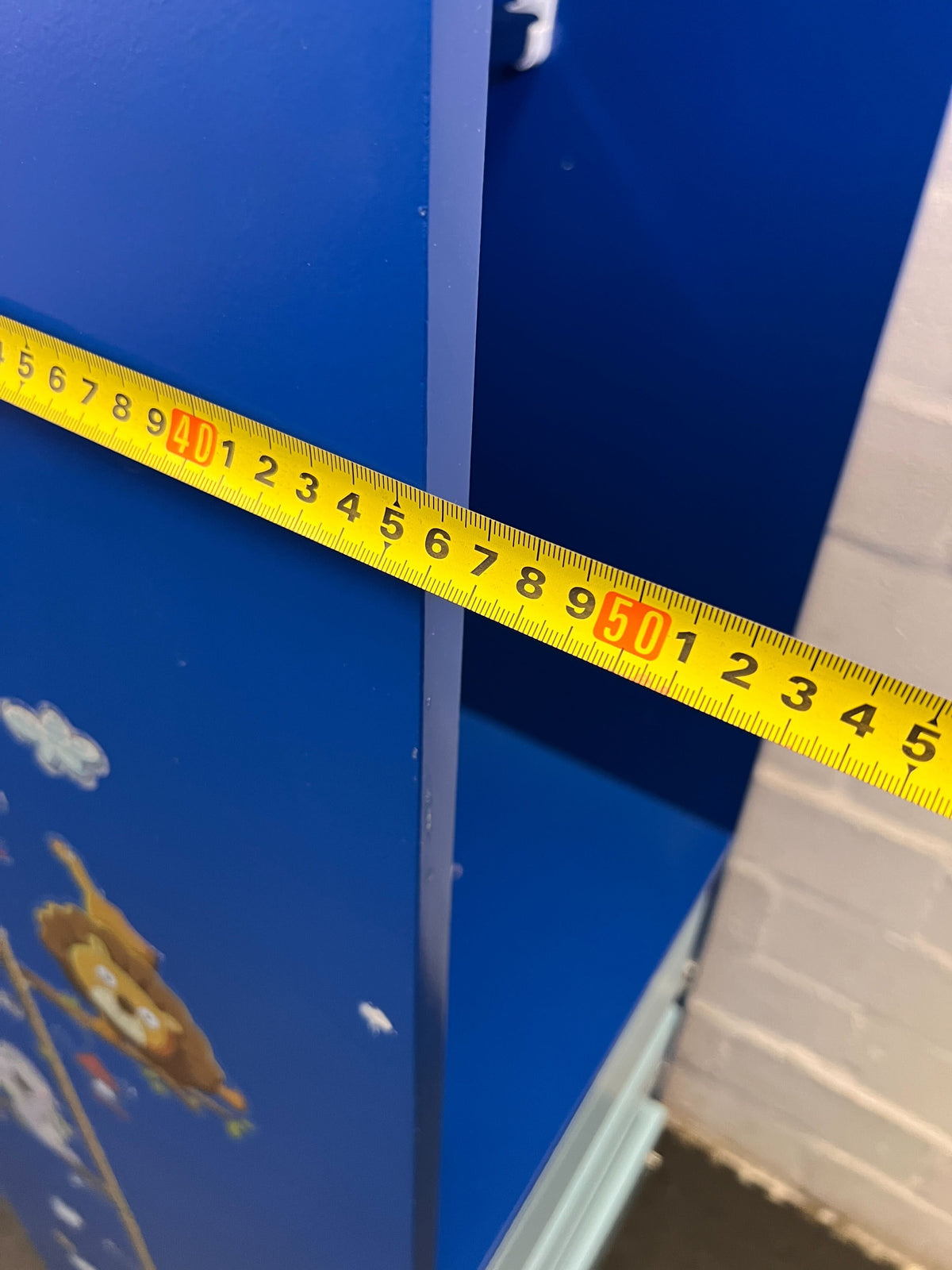 Stylish Blue Storage Unit with Drawers and Hanging Rod