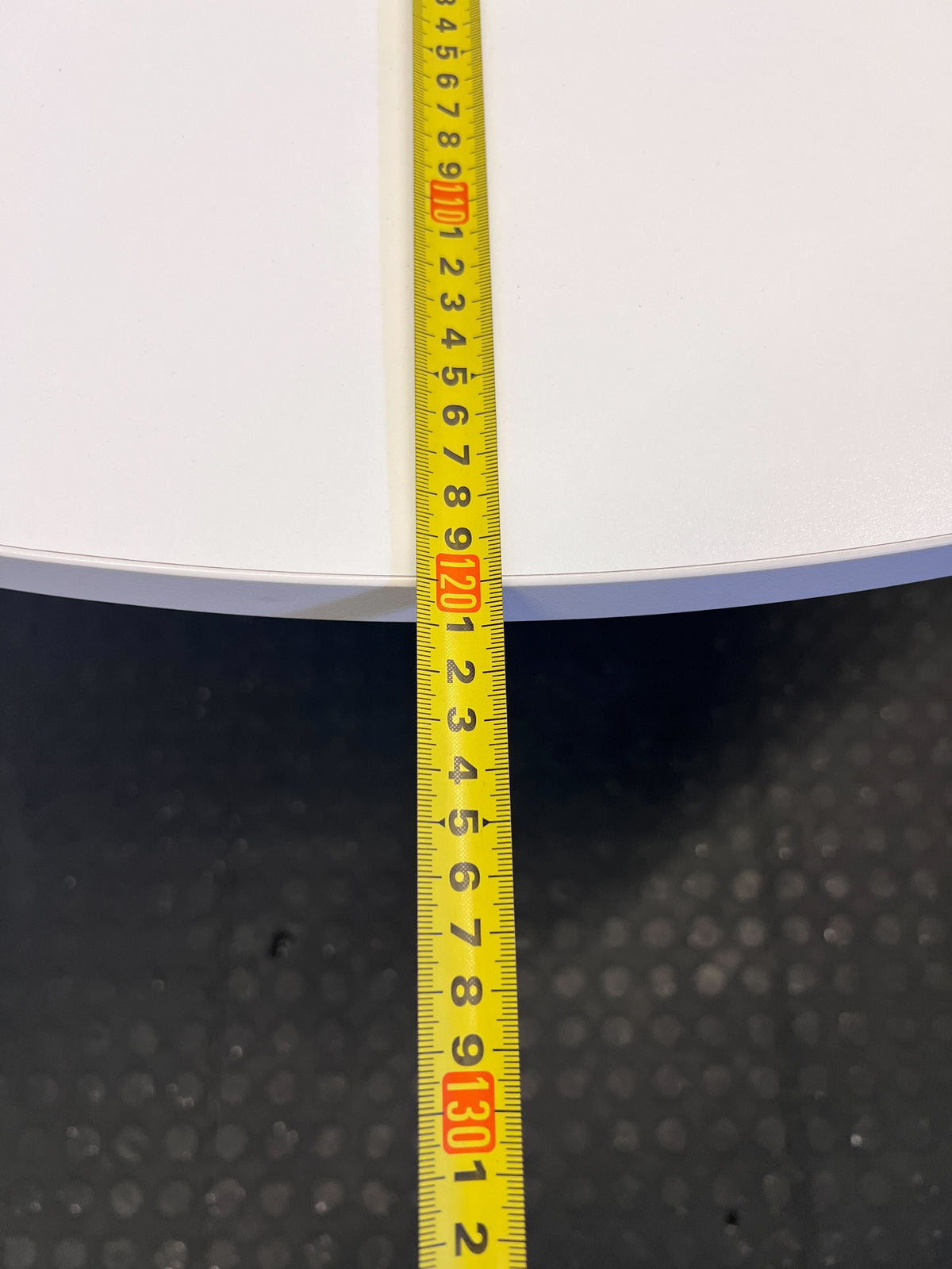 Stylish Round White Table with Modern Design and Minor Scratches