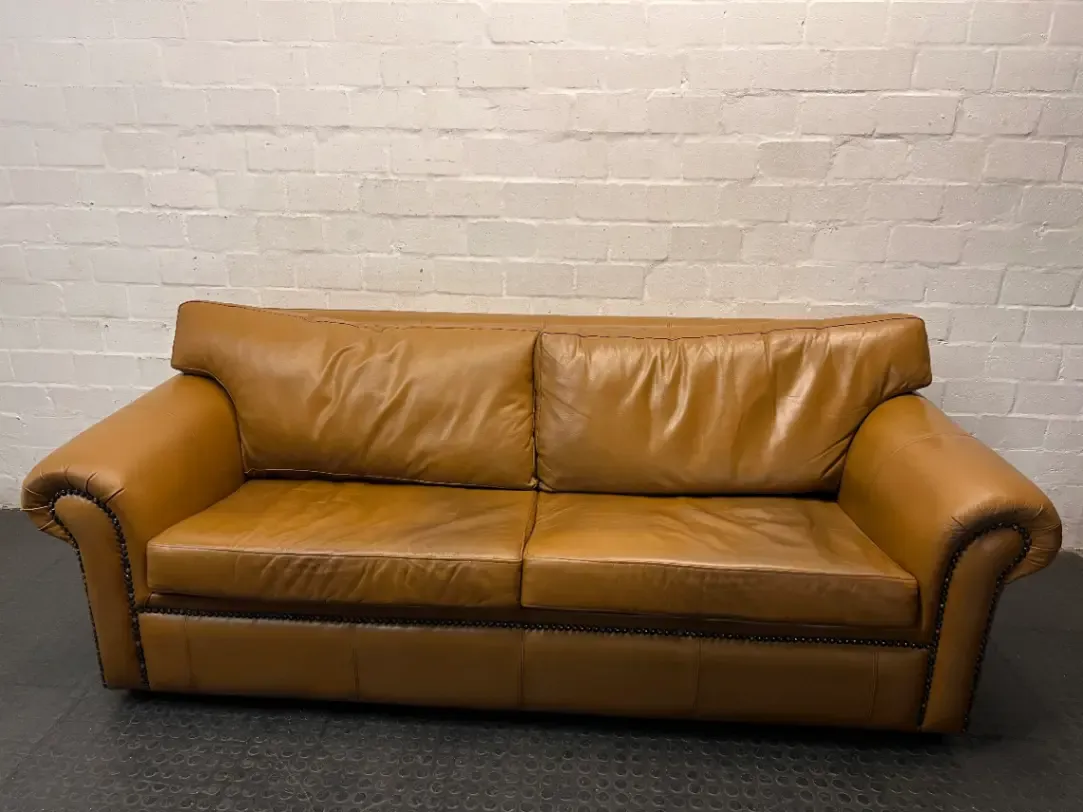 Tan 3 Seater Couch with Scrolled Arms and Stud Detail — Fair Condition