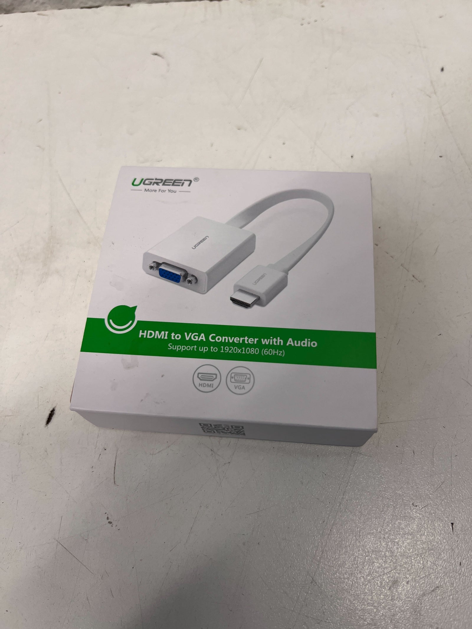 Ugreen HDMI to VGA converter with audio adapter packaging on a white surface