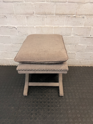 Upholstered X-Frame Ottoman with Nickel Stud Details — Tear and Marker Stains on Top Surface - 2ndhandwarehouse.com