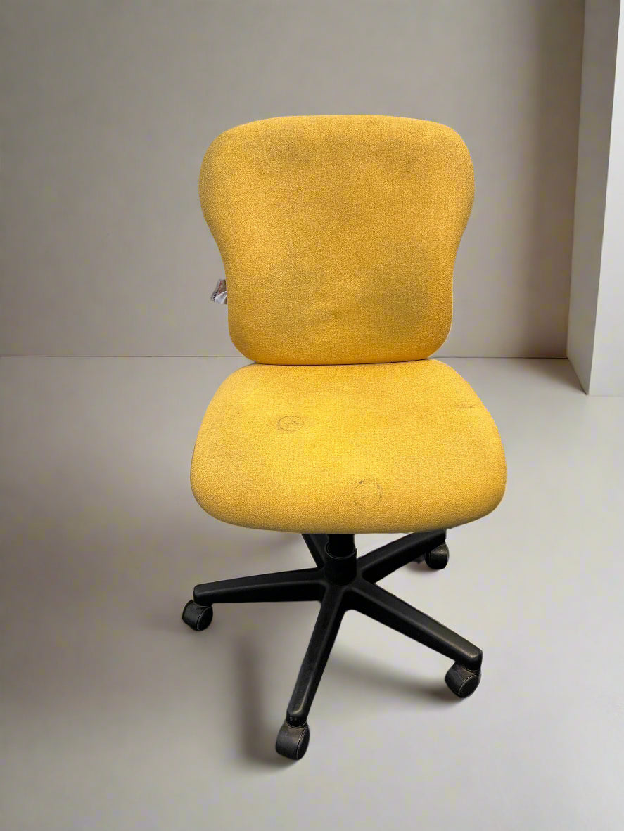 Yellow office chair with black base on a plain floor.
