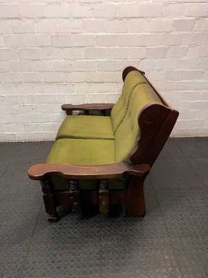 Vintage Style Green Fabric 2 Seater Couch with Wood Frame — Aged State with Scratched Woodwork