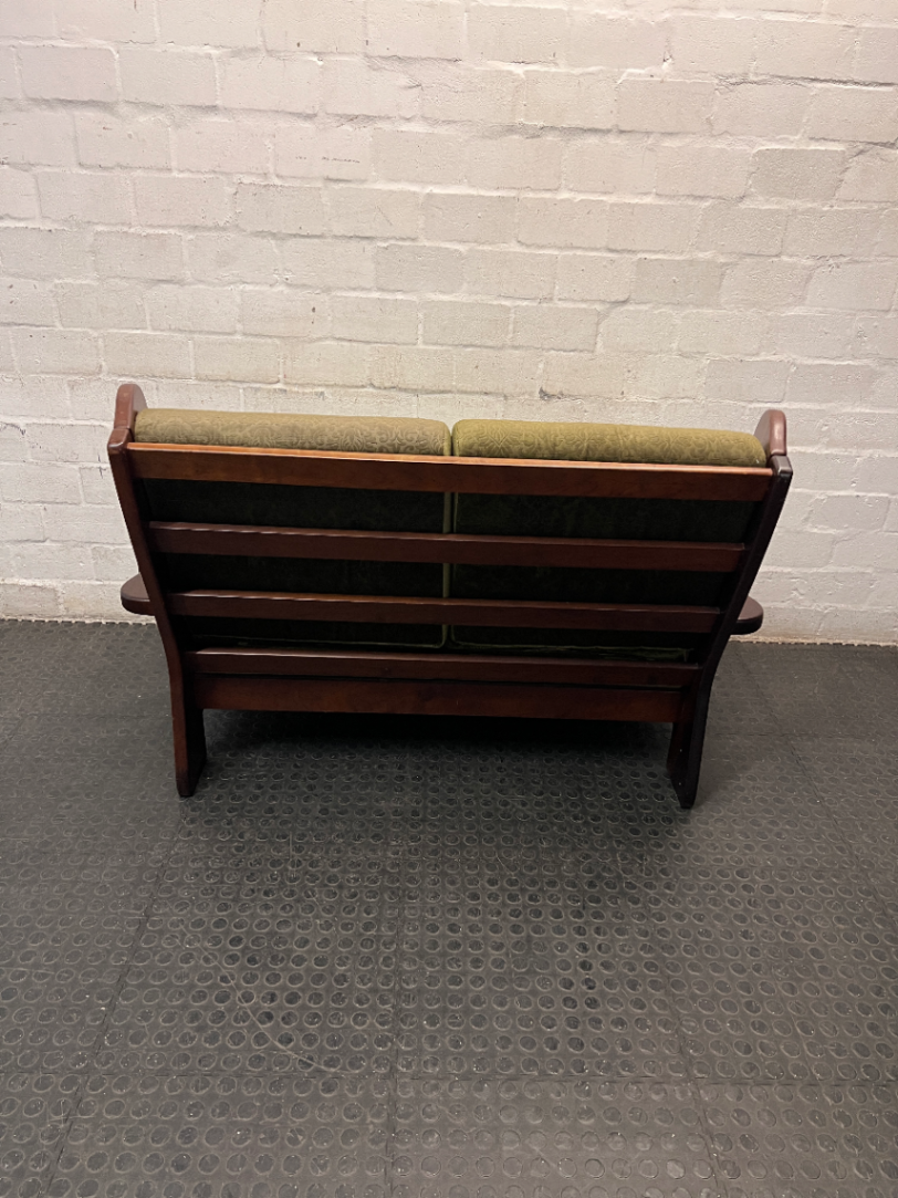 Vintage Style Green Fabric 2 Seater Couch with Wood Frame — Aged State with Scratched Woodwork