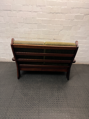 Vintage Style Green Fabric 2 Seater Couch with Wood Frame — Aged State with Scratched Woodwork