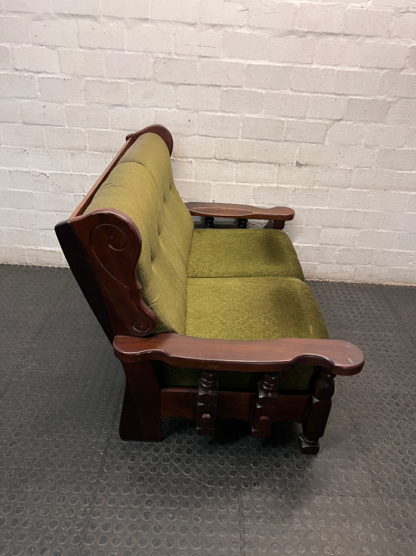 Vintage Style Green Fabric 2 Seater Couch with Wood Frame — Aged State with Scratched Woodwork