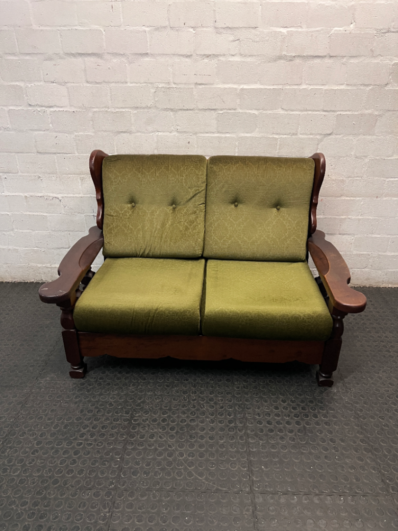 Vintage Style Green Fabric 2 Seater Couch with Wood Frame — Aged State with Scratched Woodwork