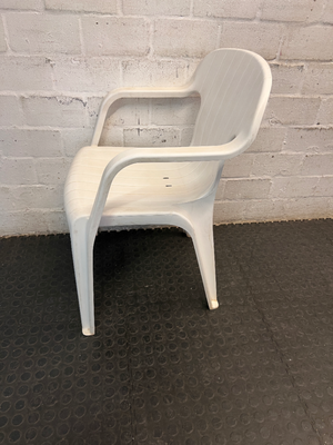 White Moulded Plastic Outdoor Armchair — Surface Wear and Cracks