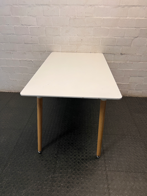 White Rectangular Table with Tapered Wooden Legs — Fair Used Condition