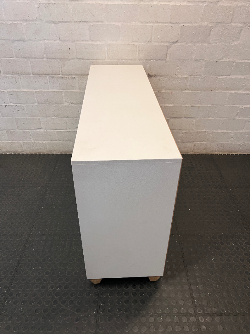 White Storage Cabinet with 4 Drawers and Wood Legs — Small Mark on One Drawer Face