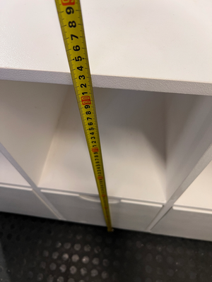White Storage Cabinet with 4 Drawers and Wood Legs — Small Mark on One Drawer Face