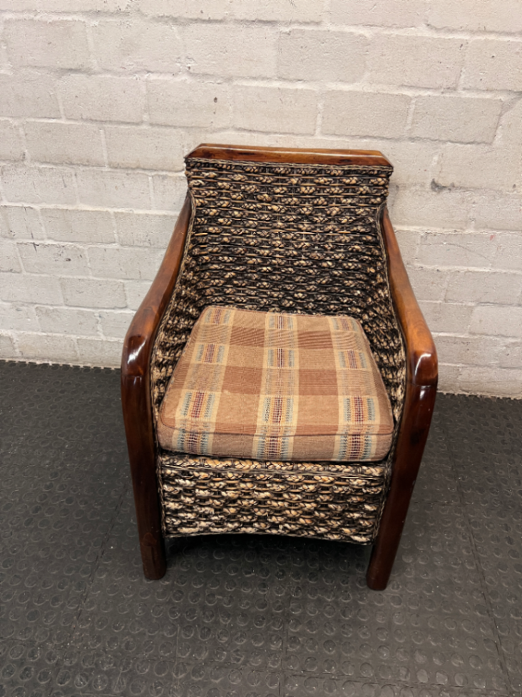 Woven Wicker and Dark Wood Armchair — Fair Used Condition with Faded Cushion