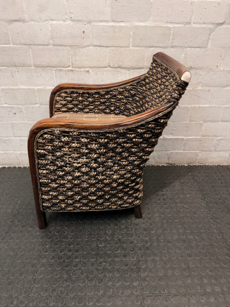 Woven Wicker and Dark Wood Armchair — Fair Used Condition with Faded Cushion