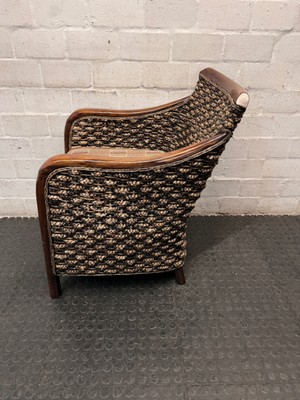 Woven Wicker and Dark Wood Armchair — Fair Used Condition with Faded Cushion