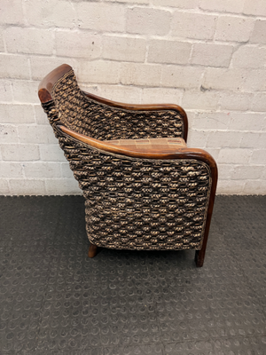 Woven Wicker and Dark Wood Armchair — Fair Used Condition with Faded Cushion
