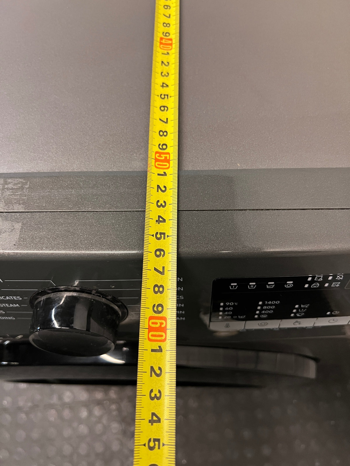 Samsung Front Loader Washing Machine in Grey — Good Working Order with Fair Exterior Wear – depth measurement