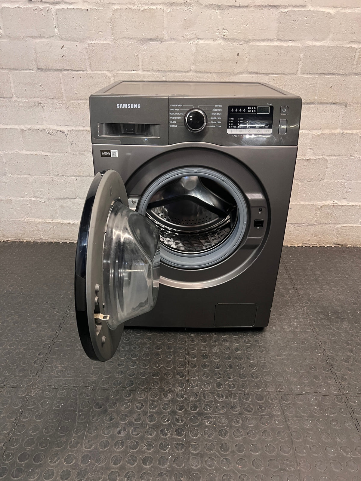Samsung Front Loader Washing Machine in Grey — Good Working Order with Fair Exterior Wear – side view