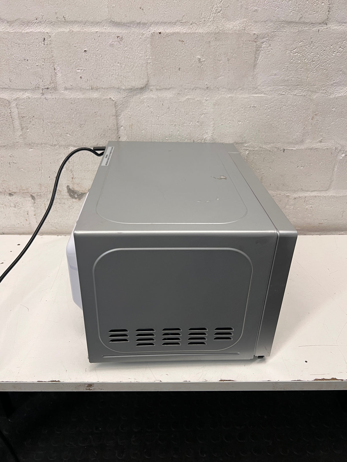 AEG Countertop Microwave with Mirrored Finish — Working; Well Used Condition – top view