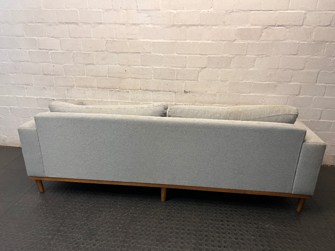Modern Grey 3 Seater Couch with Tapered Wooden Legs — Small Tear on Cushion – back view