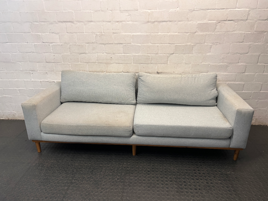 Modern Grey 3 Seater Couch with Tapered Wooden Legs — Small Tear on Cushion – main front view