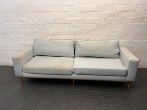 Modern Grey 3 Seater Couch with Tapered Wooden Legs — Small Tear on Cushion – main front view
