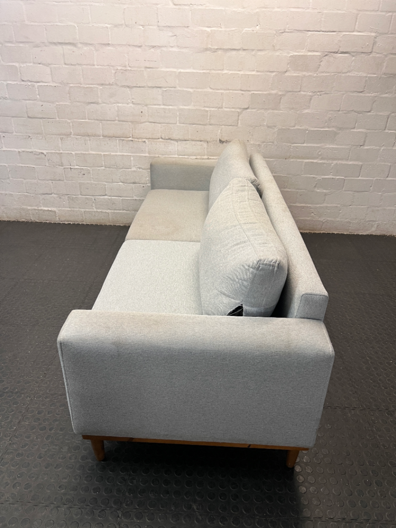 Modern Grey 3 Seater Couch with Tapered Wooden Legs — Small Tear on Cushion – side view