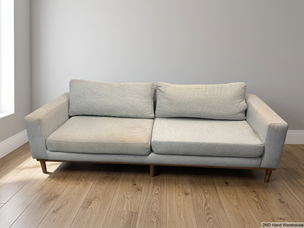 Modern Grey 3 Seater Couch with Tapered Wooden Legs — Small Tear on Cushion – styled product image