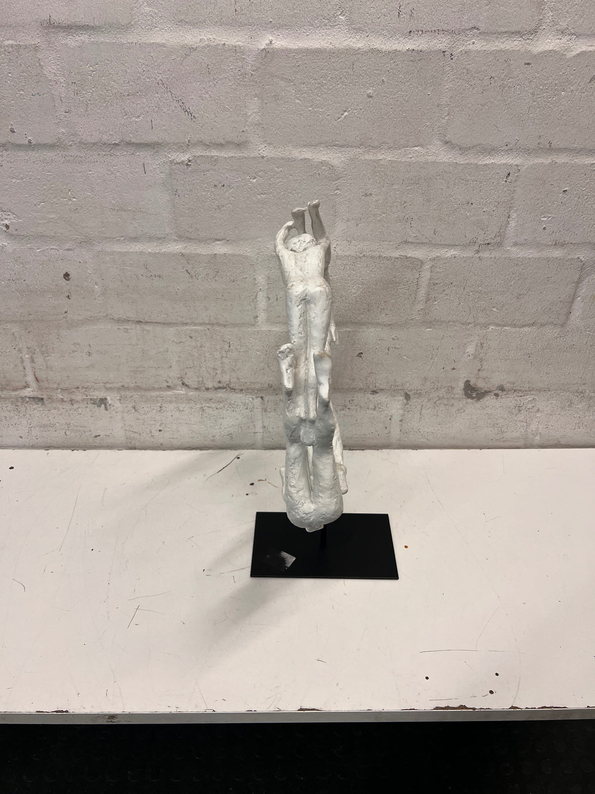 White Sculptural Figure Circle on Black Base — Used; Fair Condition – back view