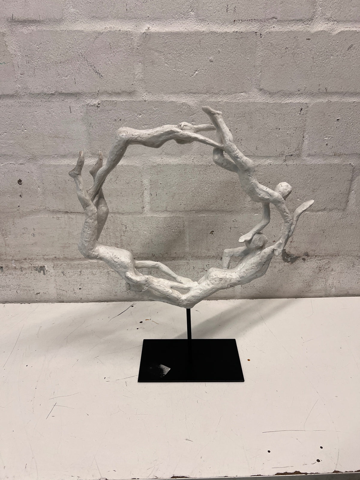White Sculptural Figure Circle on Black Base — Used; Fair Condition – condition detail