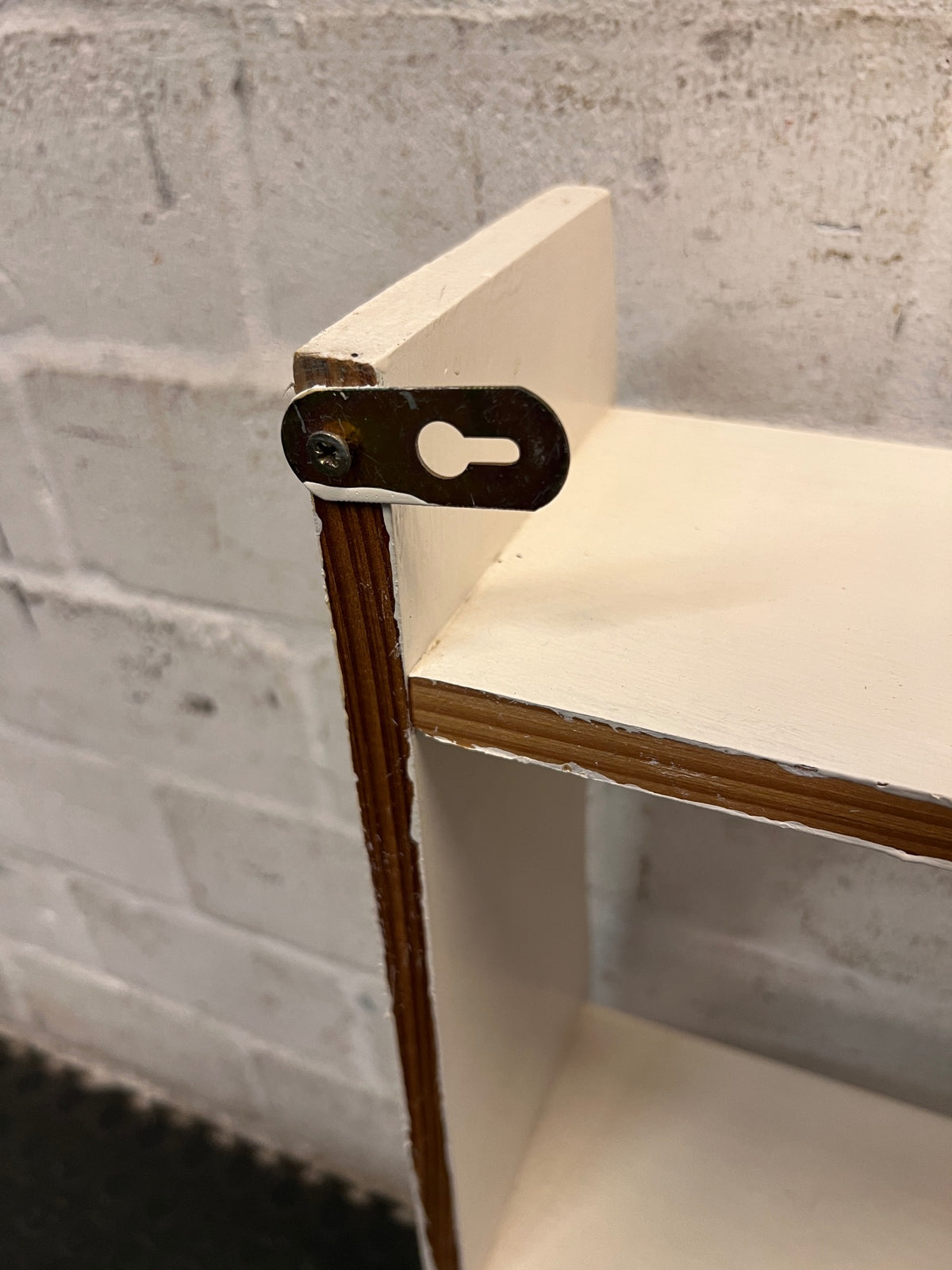 White Wooden Wall-Mounted Display Shelf — Well Used Condition – back view