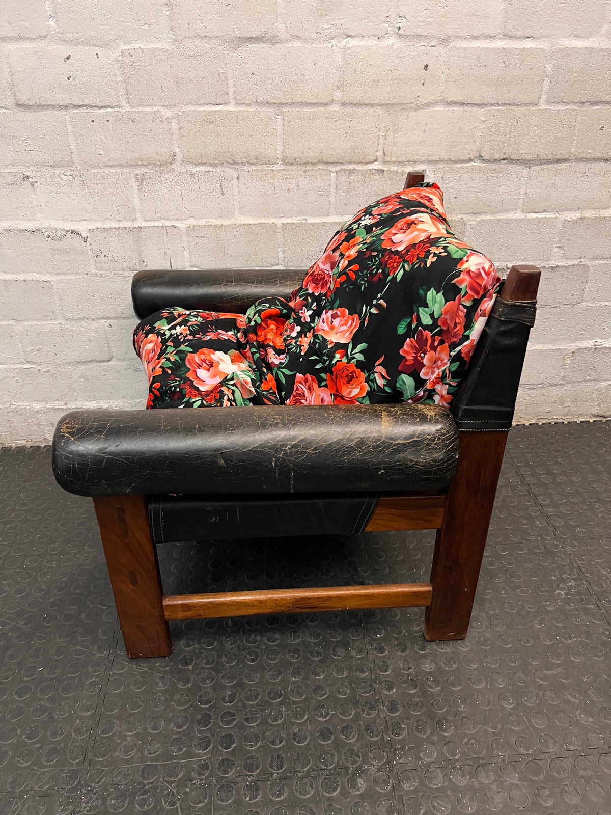 Vintage Brown Leather Armchair with Floral Cushion — Well Used with Significant Leather Wear – back view