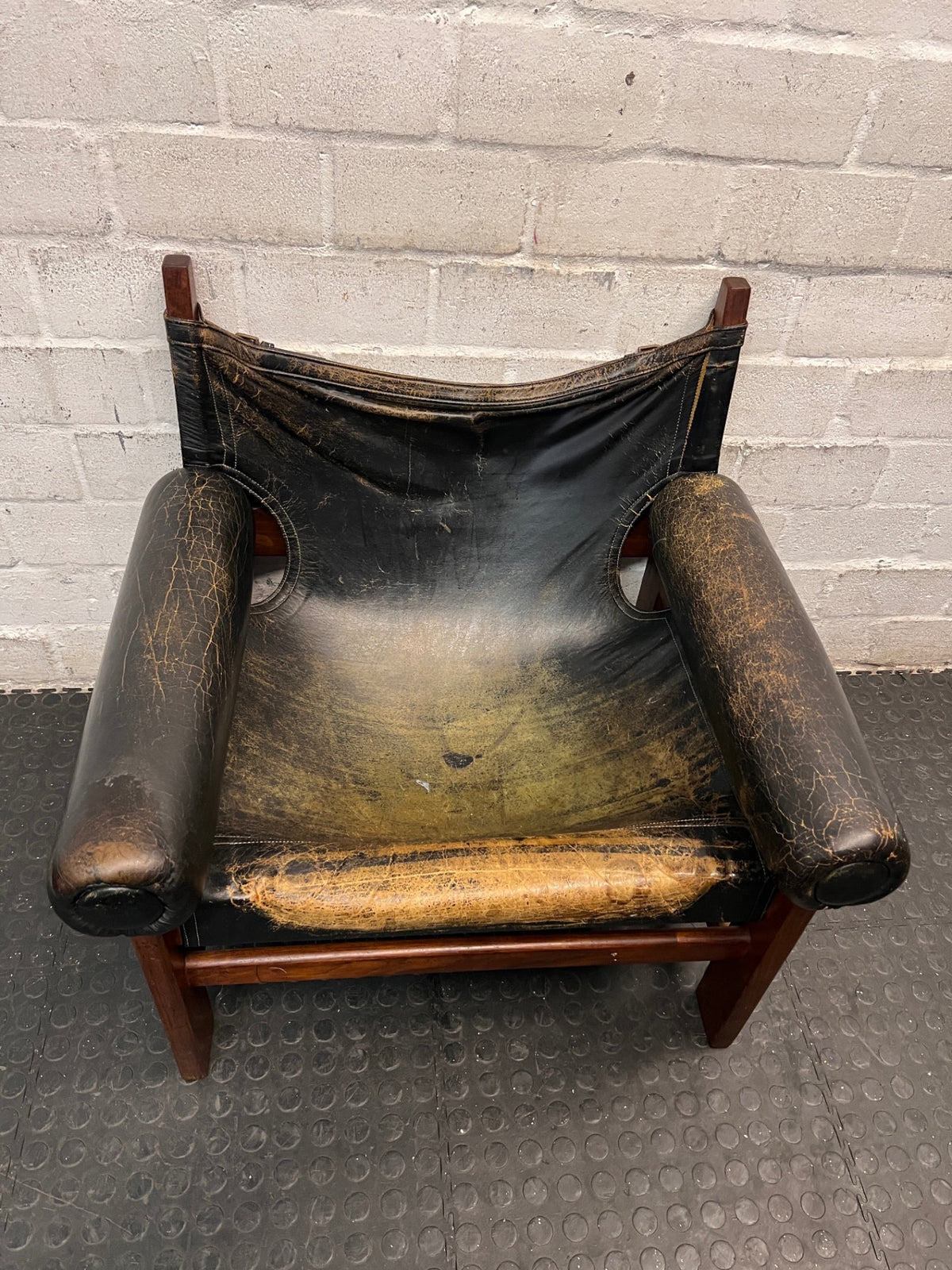 Vintage Brown Leather Armchair with Floral Cushion — Well Used with Significant Leather Wear – condition detail