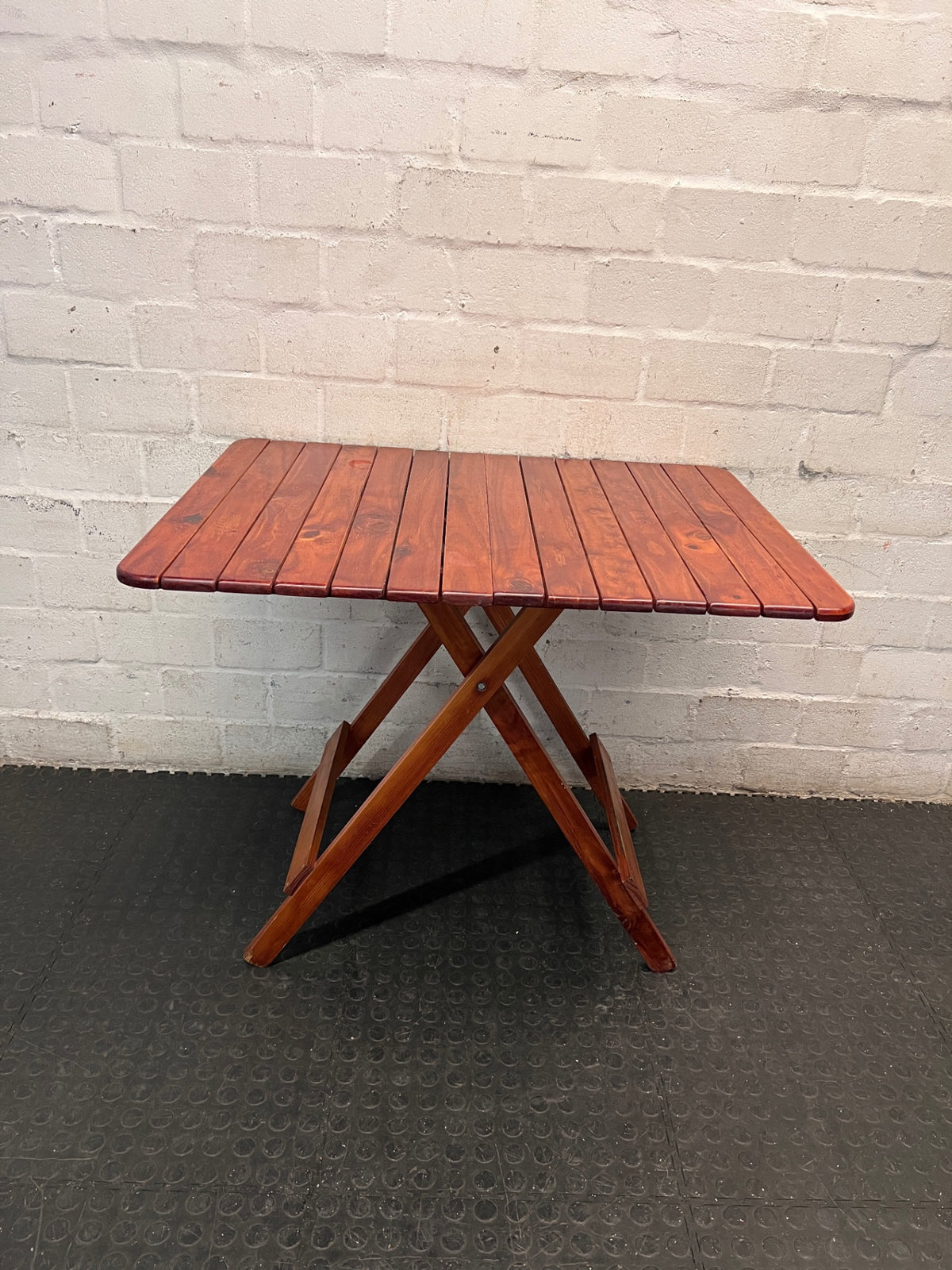 Foldable Slatted Timber Table in Warm Brown — Fair Condition with Visible Wear – condition detail
