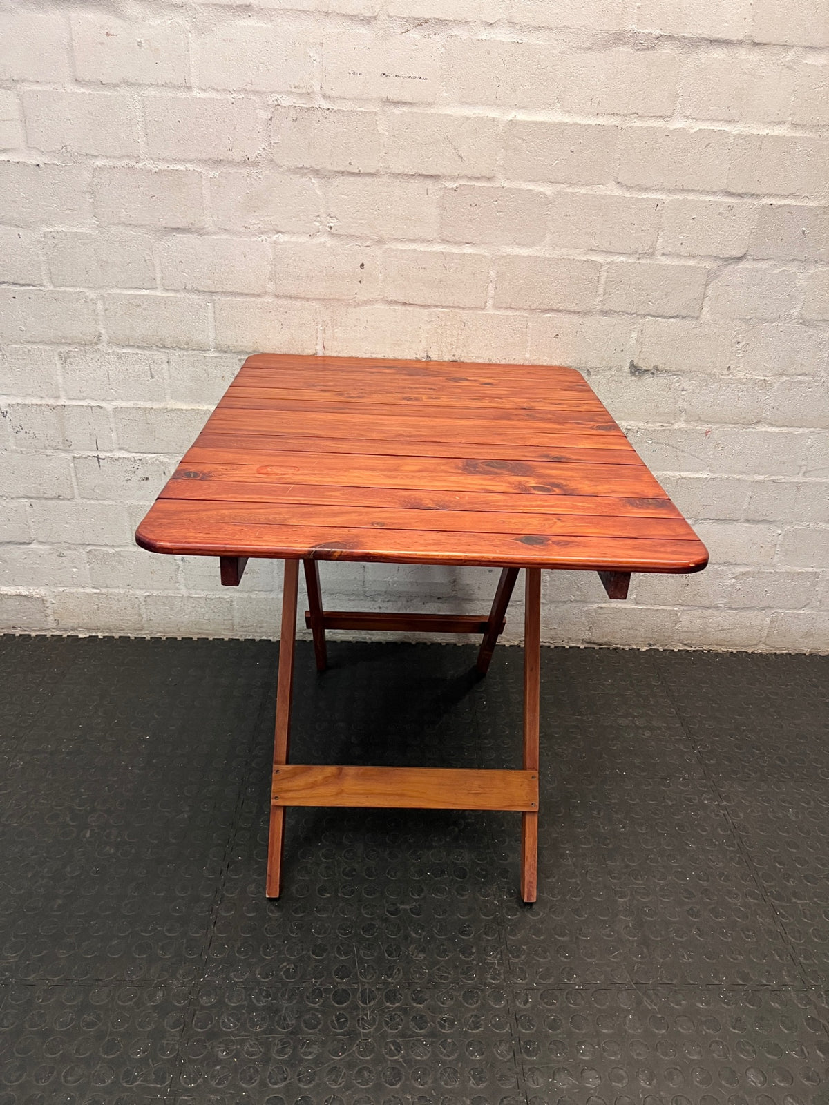Foldable Slatted Timber Table in Warm Brown — Fair Condition with Visible Wear – side view