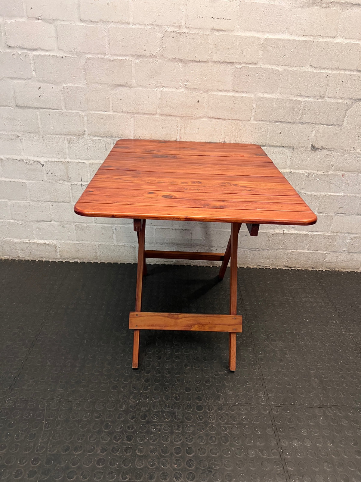 Foldable Slatted Timber Table in Warm Brown — Fair Condition with Visible Wear – top view
