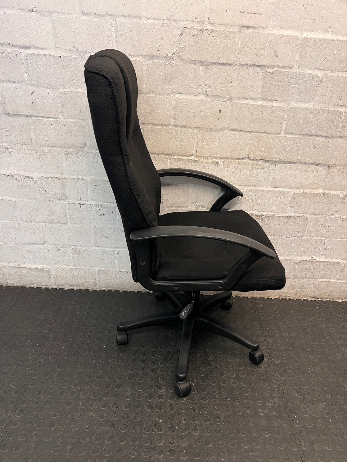 Black High-Back Fabric Office Chair — Broken Wheels – back view