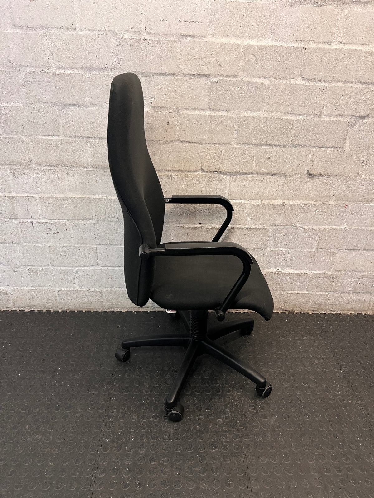 High-Back Black Fabric Office Chair — Broken Wheels – back view