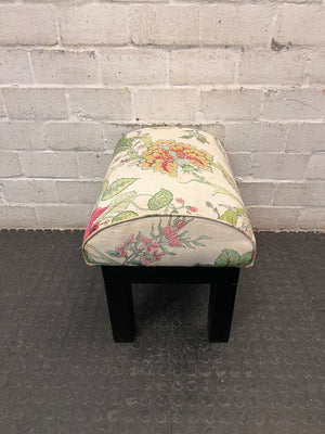 Floral Upholstered Ottoman with Black Timber Legs — Fair Condition With Visible Wear – back view