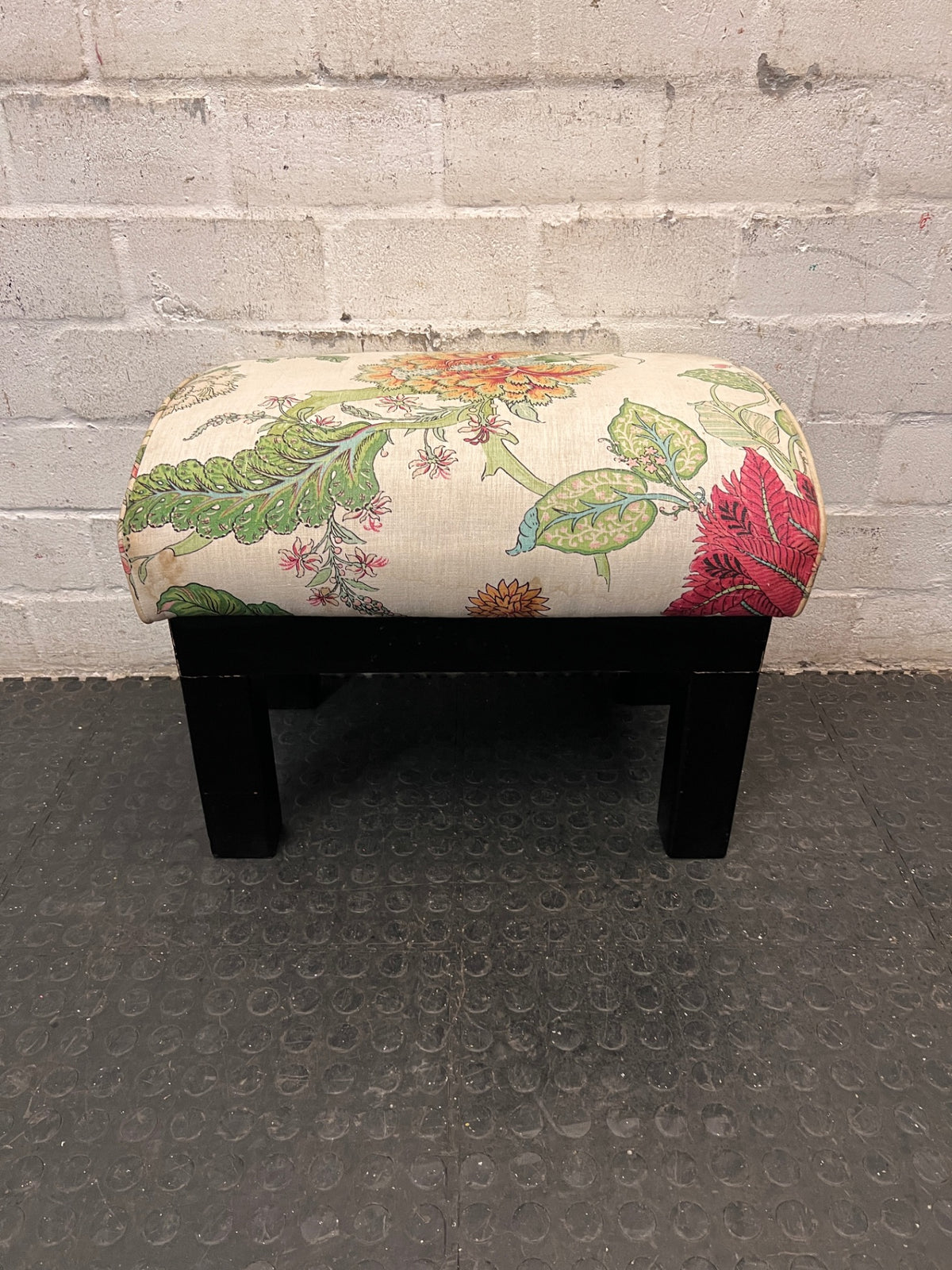 Floral Upholstered Ottoman with Black Timber Legs — Fair Condition With Visible Wear – top view