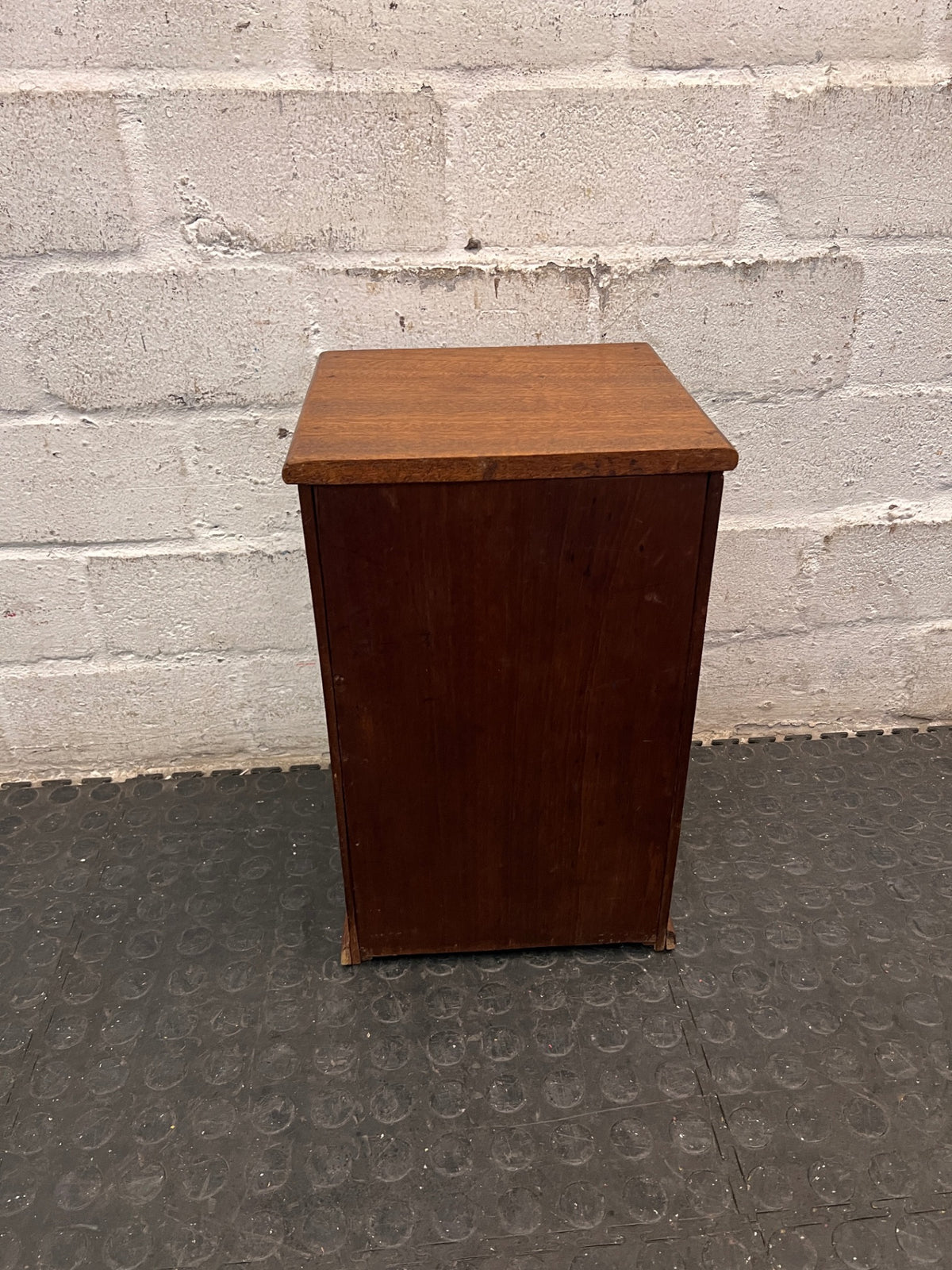 Compact Wooden Cabinet with Drawer — Fair Condition with Visible Wear – back view