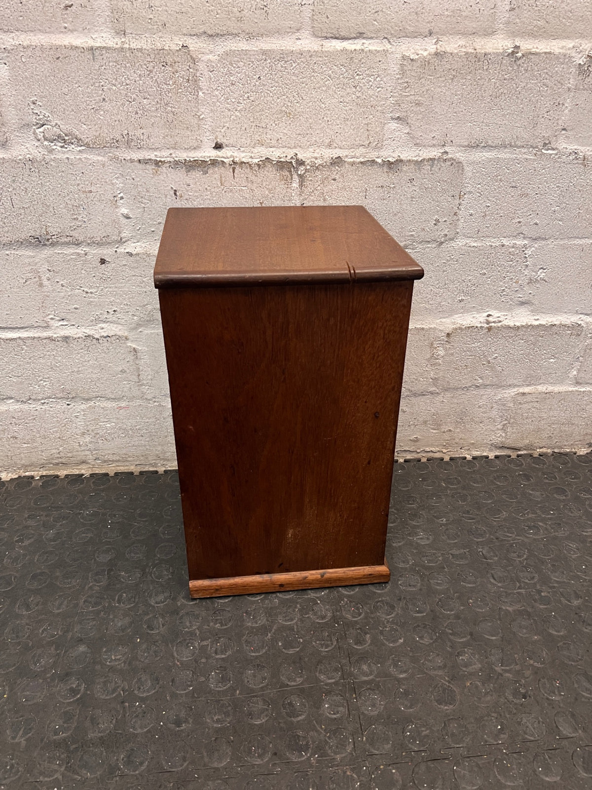 Compact Wooden Cabinet with Drawer — Fair Condition with Visible Wear – top view