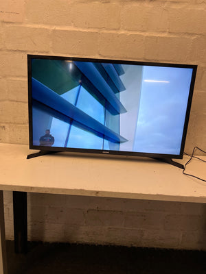 Samsung Flat-Screen Television with Stand — Good Working Order – side view