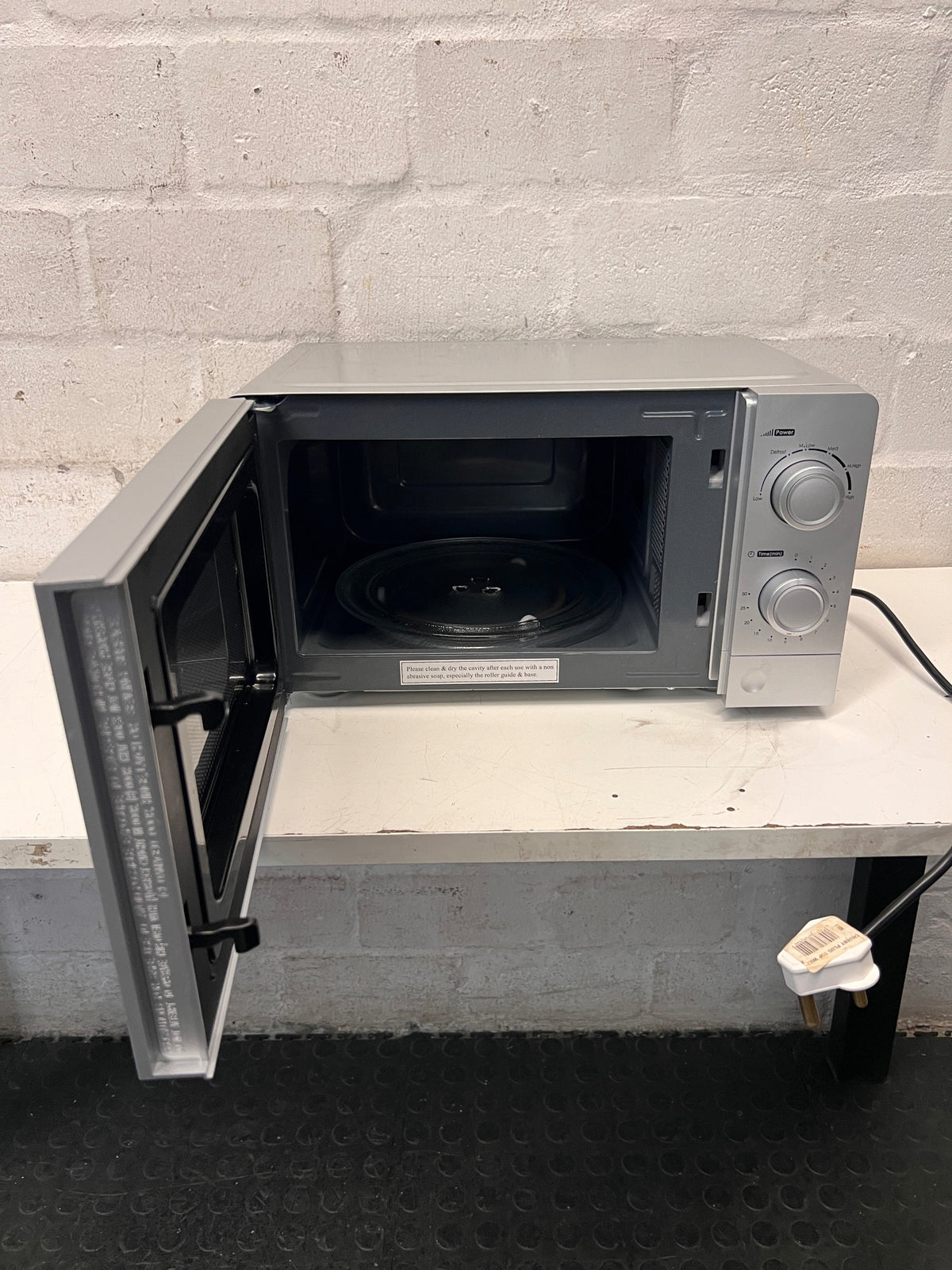 Defy Silver Countertop Microwave with Manual Control Dials — Good Working Order – side view