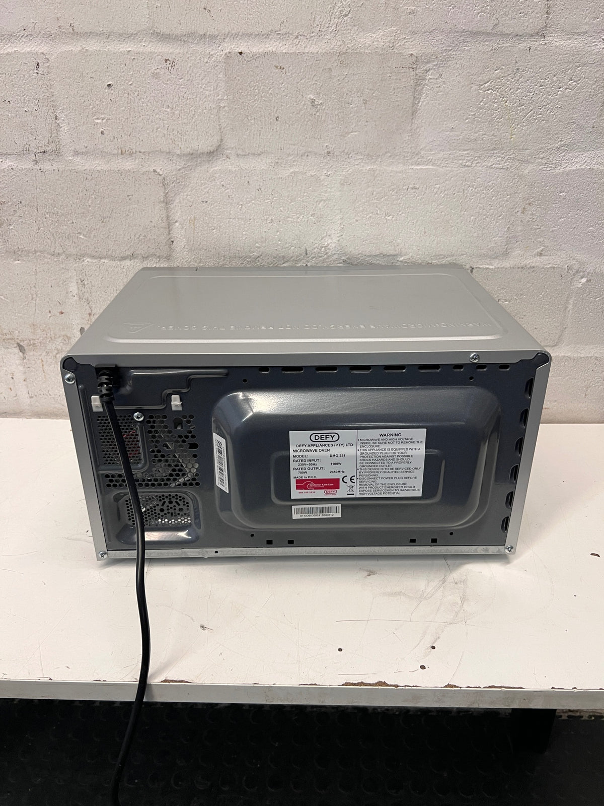 Defy Silver Countertop Microwave with Manual Control Dials — Good Working Order – top view