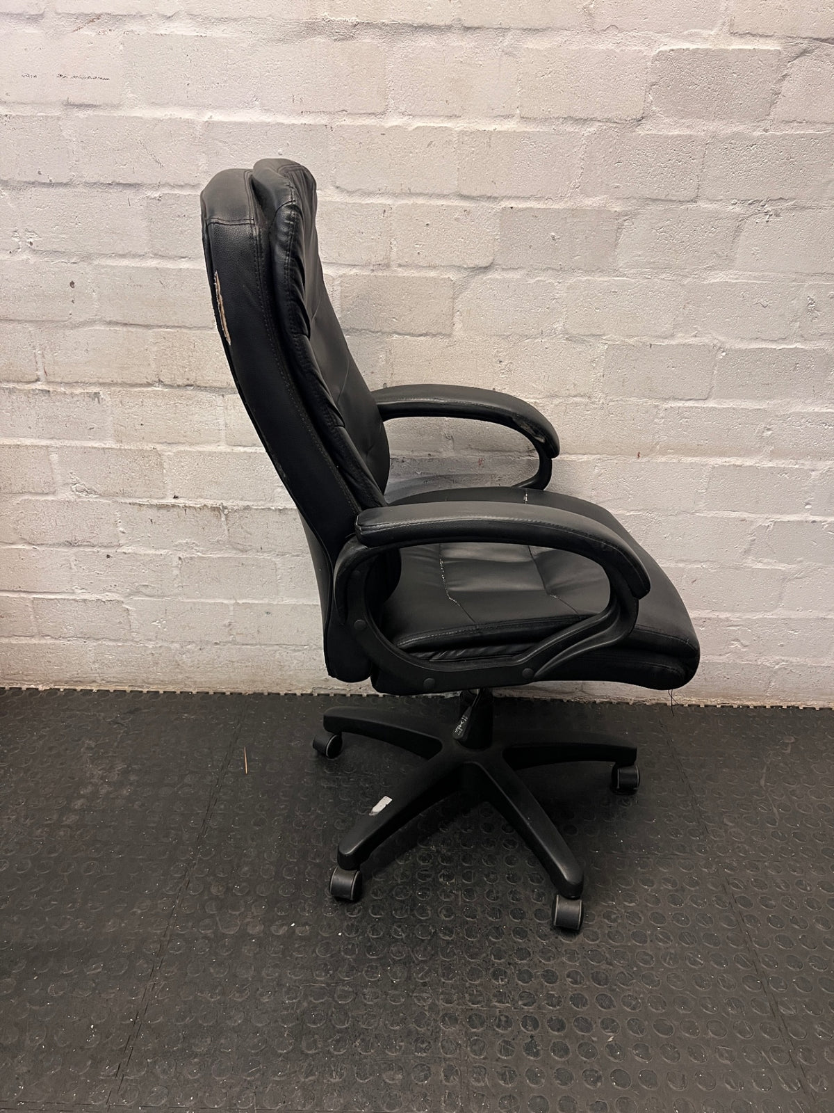 Black Faux-Leather High Back Office Chair — Significant Wear and Tear Damage – top view