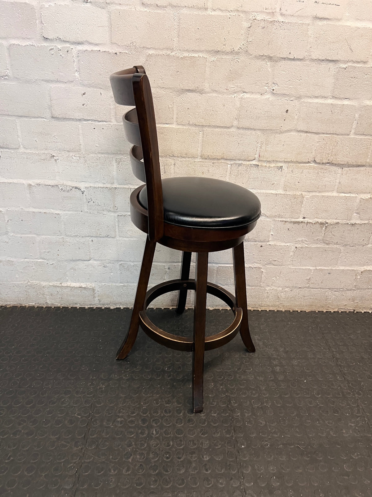Dark Brown Wooden Bar Stool with Leather-Look Padded Seat — Frame Scuffs and Scratched Leather Seats – condition detail